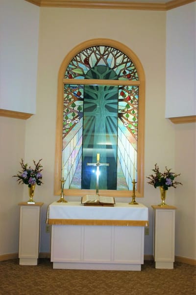 Interior chapel with stained glass window and altar