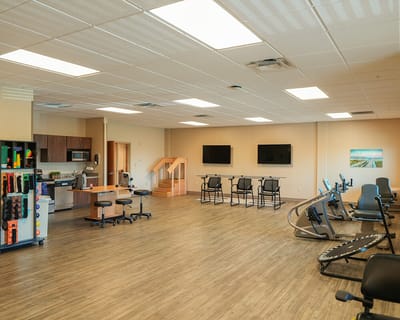 Interior view of a multi-use activity room with exercise equipment