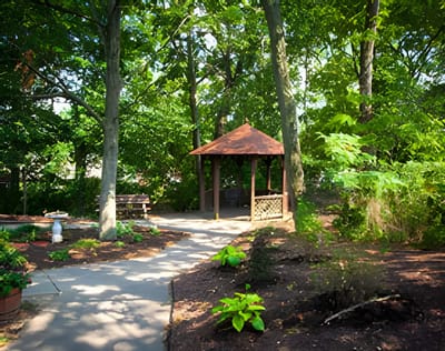 Pathway leading to a gazebo in a landscaped area