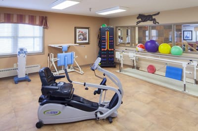 Interior view of a therapy room with exercise equipment