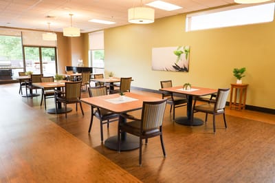Dining room with tables set for meals