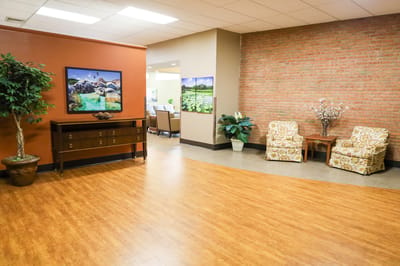 Cozy common area with armchairs and artwork