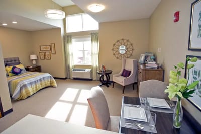 Bright interior of a resident's room with furniture