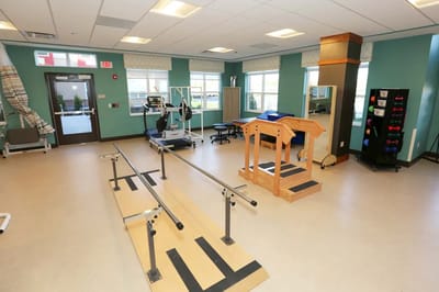 Interior view of a therapy exercise room with equipment