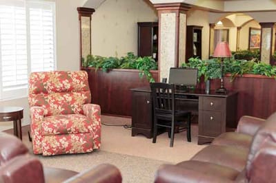 Cozy common area with seating and a computer desk