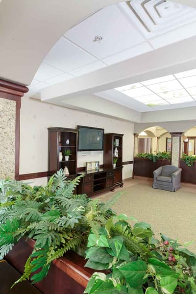 Bright common area with seating and plants