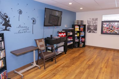 Bright common area with blue wall and decor