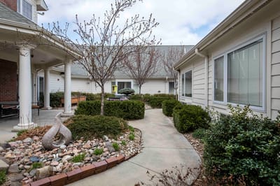 Pathway through landscaped courtyard of assisted living facility