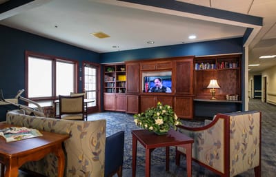 Interior common area with seating and a television