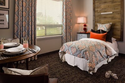 Cozy resident room with bedding and decor