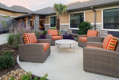 Outdoor seating area with modern chairs and table