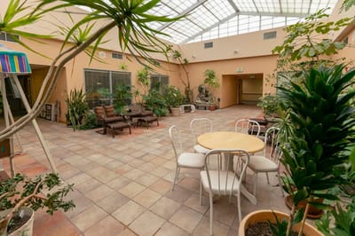 Indoor common area with seating and plants