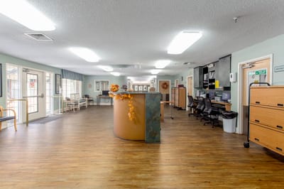 Interior view of a common area with a reception desk