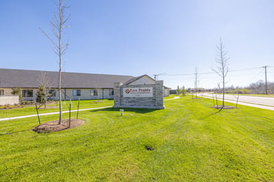 Exterior view of Five Points of College Station with sign