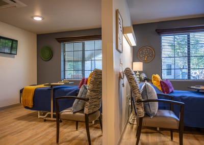 Interior view of a resident room with beds and decor
