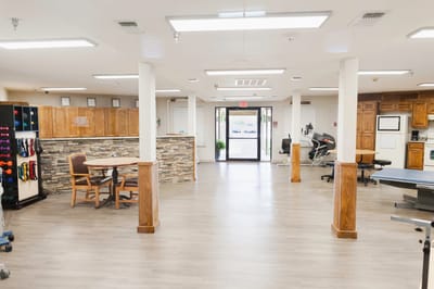 Bright interior common area with seating and equipment