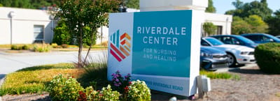 Facility logo sign at the entrance of Riverdale Center