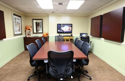 Meeting room with a long table and chairs