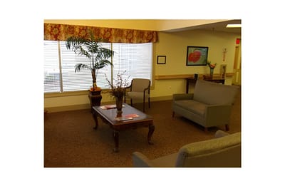 Common area with seating and decor in senior facility