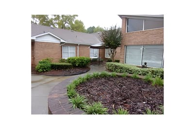Exterior view of the facility with landscaping