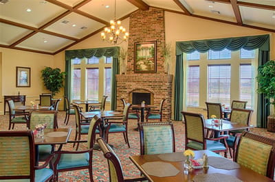 Dining area with tables and chairs in the facility