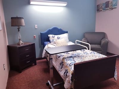 Private resident room with bed and furnishings