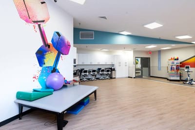 Colorful therapy equipment in a bright rehabilitation room
