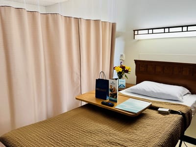 Cozy resident room with flowers and welcome kit