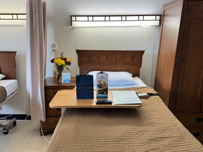 Well-decorated resident room with welcome items