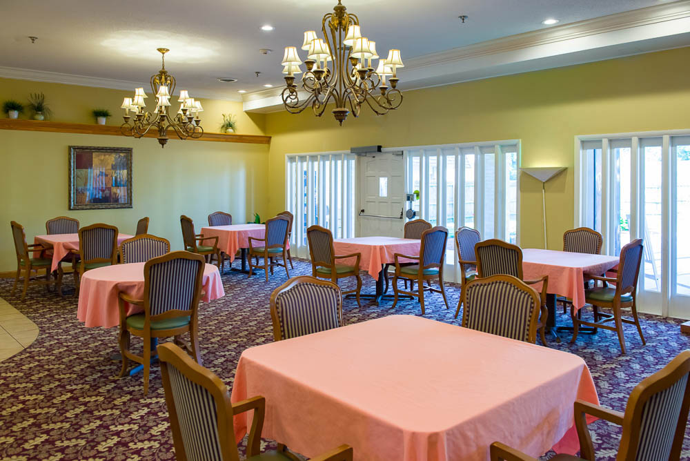 Bright dining area with tables and chairs