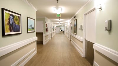 Bright hallway with artwork in a senior living facility