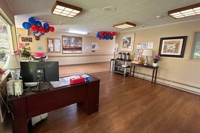 Bright common area with decorative balloons and seating