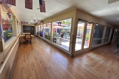 Hallway leading to an outdoor space with residents