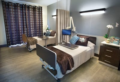Private resident room with two beds and decor