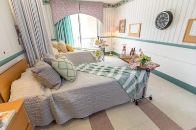 Shared resident room with beds and decorative elements