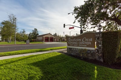 Exterior view of Anaheim Crest Nursing Center sign and building