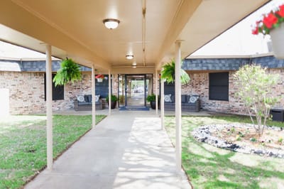 Covered walkway leading to facility entrance