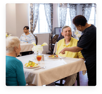 Residents enjoying a meal in the dining area.