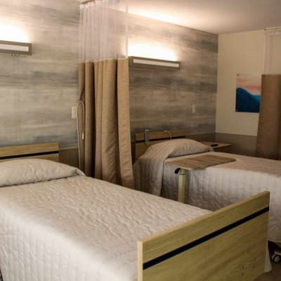 Two twin beds in a shared resident room
