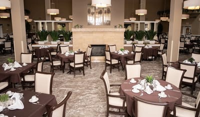 Elegant dining room with set tables and decor