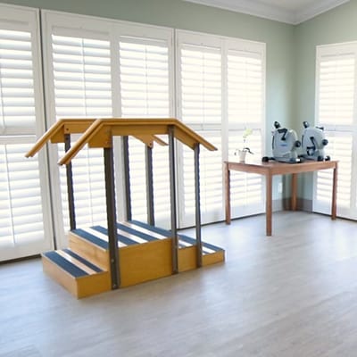 Interior rehabilitation space with stairs and equipment.