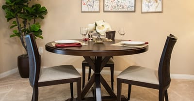 Dining table set for a meal in a cozy room.