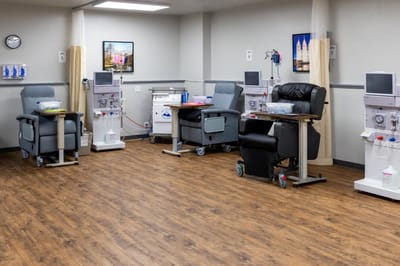 Interior view of treatment area with medical chairs and equipment.