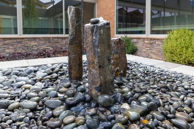 Outdoor water feature with pebbles and stones