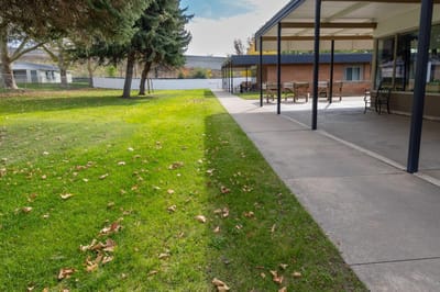 Well-kept outdoor space with pathways and grass
