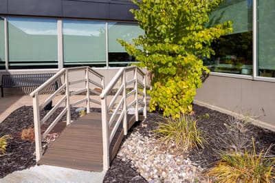 Accessible bridge in landscaped outdoor area