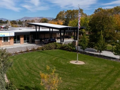 Exterior view of Heritage Park Nursing Center with landscaping.