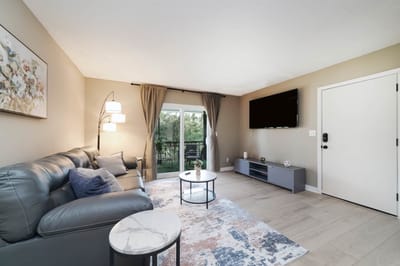 Cozy common area with modern furniture and natural light.