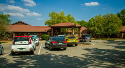 Exterior view of Florence Park Care Center entrance and parking lot.