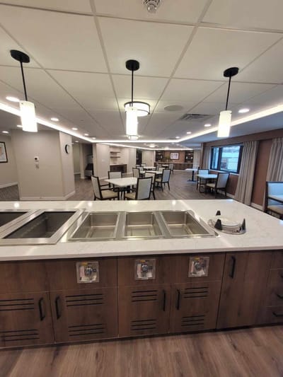 Dining area with tables and kitchen counter